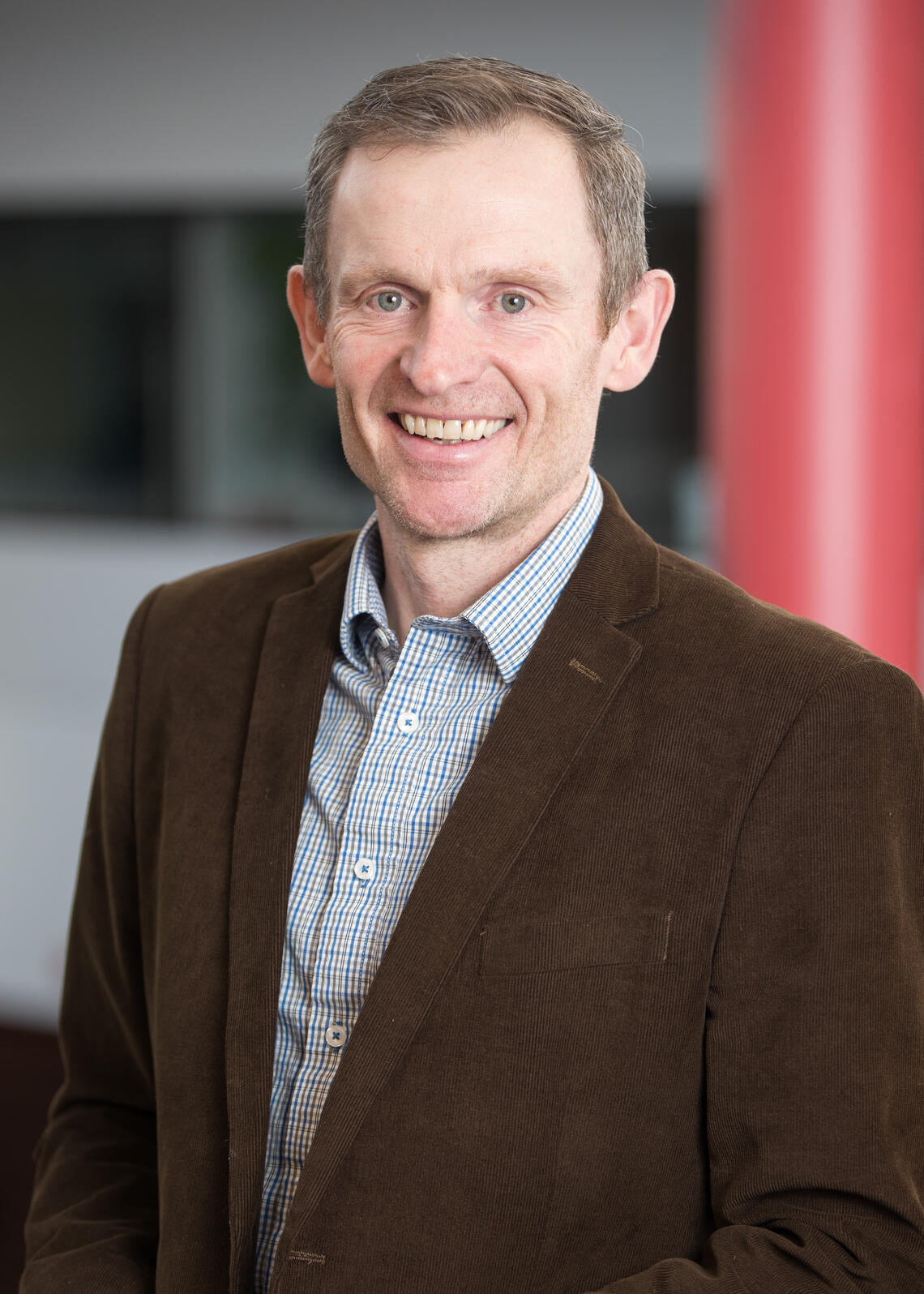 portrait photo of a man in a blazer