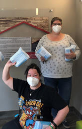 Staff at Murray’s House, an independent housing facility that serves those who are chronically homeless and need health supports to live, showcase some of the PPE supplied by Street CCRED in June, 2020.