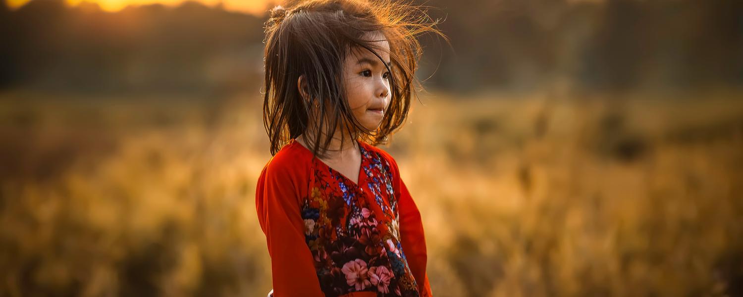 Girl standing in a sunset