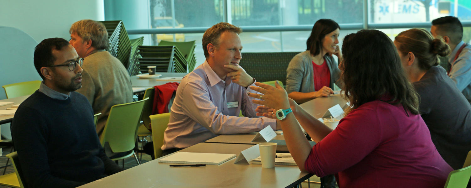 Members talking at mentorship speed dating event