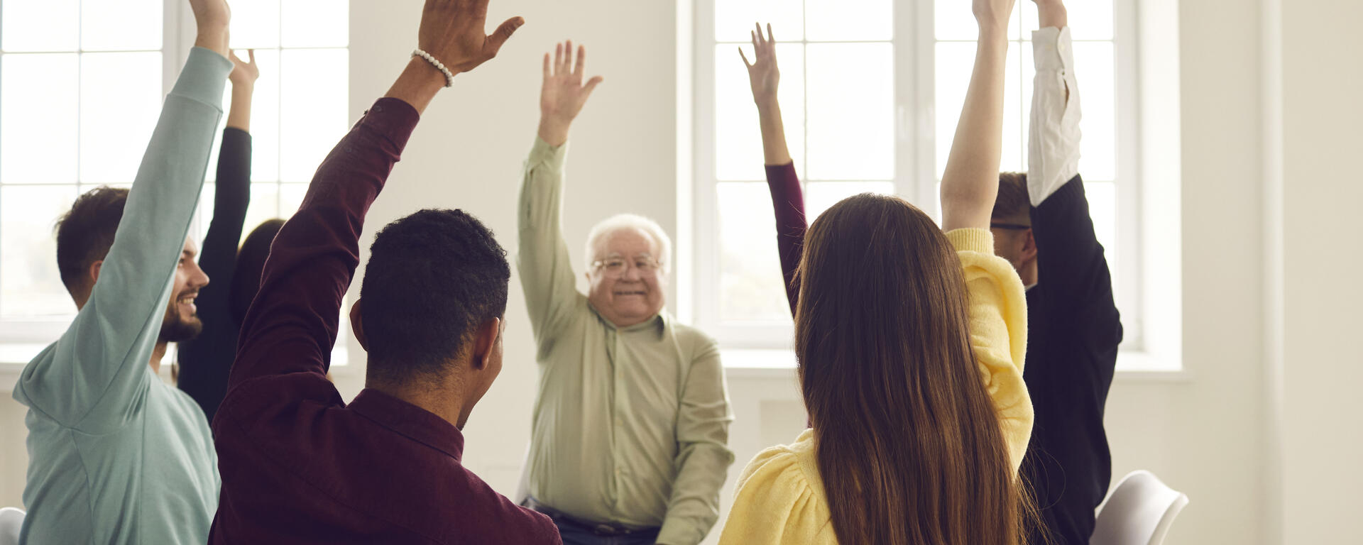 group of people with hands up