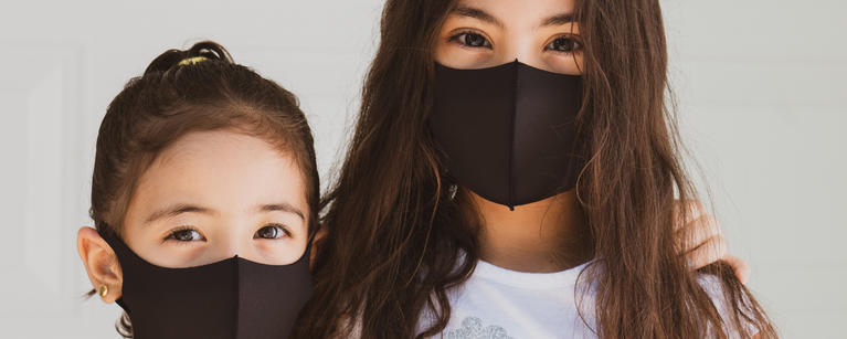 Two girls with masks
