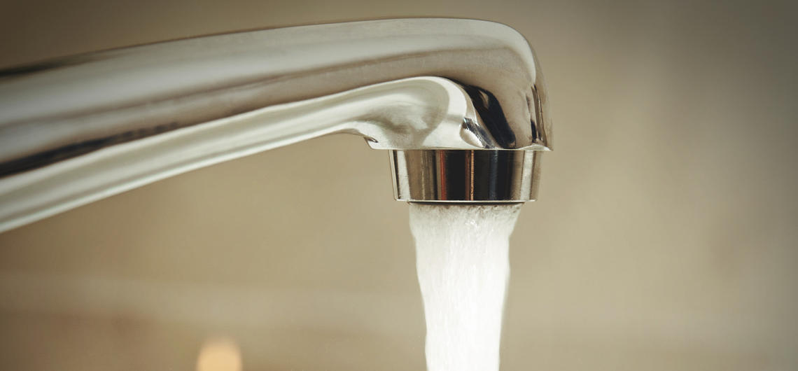 water pouring from tap 