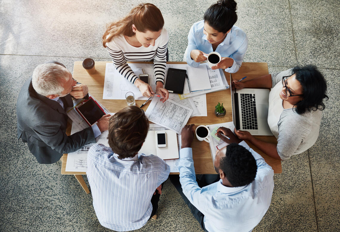 Group of researchers working at a table