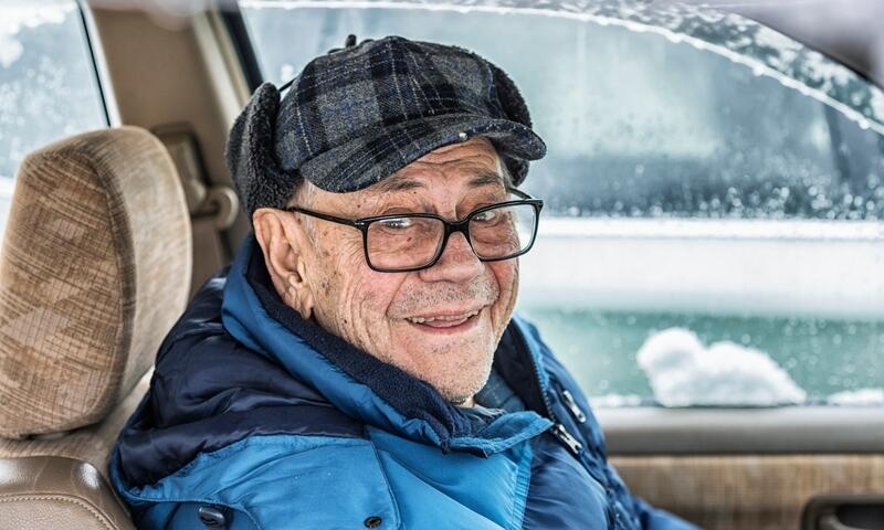 Older man in his vehicle during winter