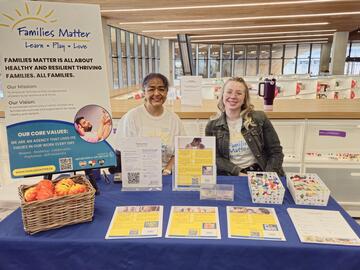 Women at booth at the Calgary Women's Health Symposium 2025