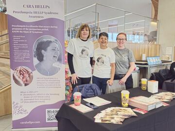 Women at booth at the Calgary Women's Health Symposium 2025