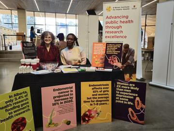 Women at booth at the Calgary Women's Health Symposium 2025