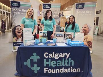 Women at booth at the Calgary Women's Health Symposium 2025