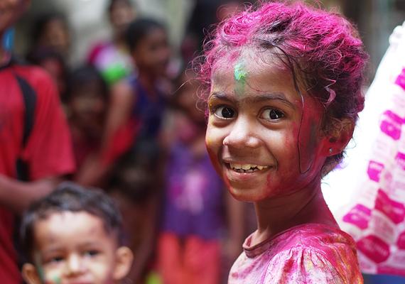 Children covered in colourful dust