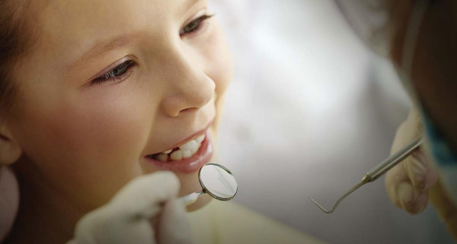 Young girl at the dentist