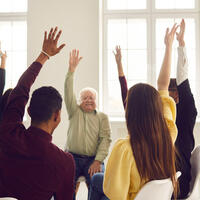 group of people with hands up